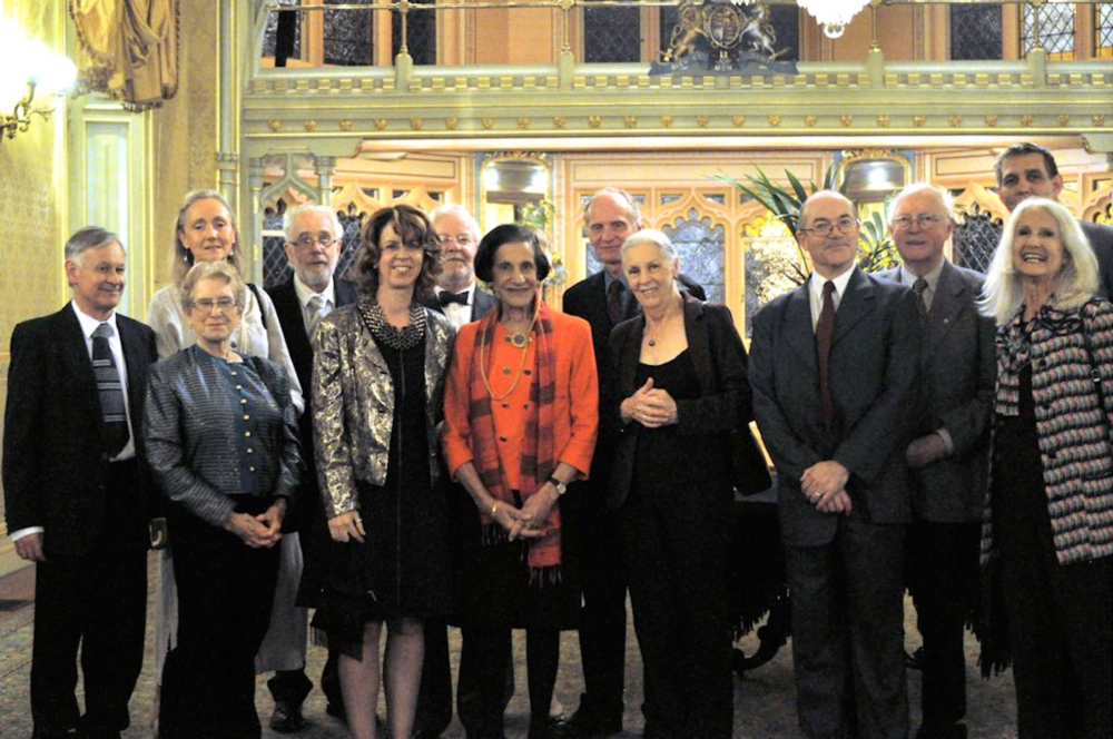 about 12 people with Governor Marie Bashir in elegant surroundings of government house